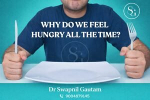 man sitting with spoon and fork to eat